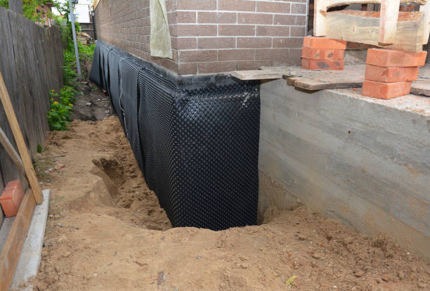 Happy homeowners after waterproofing job in La Rue